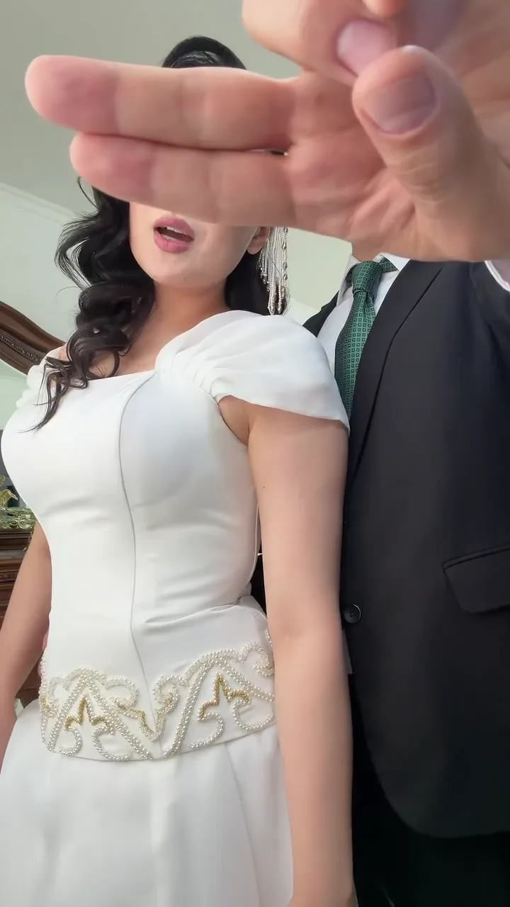 Bride and groom in a green tie