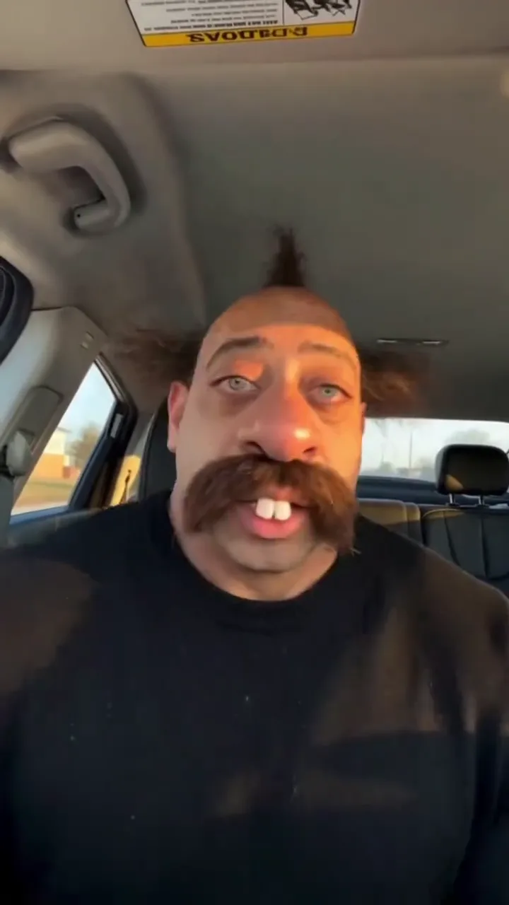 Black sweater, handlebar moustache cartoon face · 9 s · with the chant